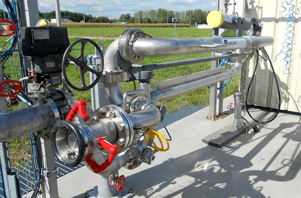 Caustic bottom loading arm with TODO Coupler