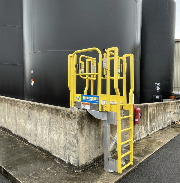 ErectaStep industrial stairs cement berm Crossover, with YellowGate safety swing gate