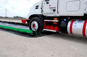 ultimate spill contiament Berm model truck driving over