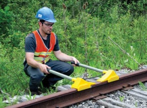 Urethane Wheel Chocks in use with worker