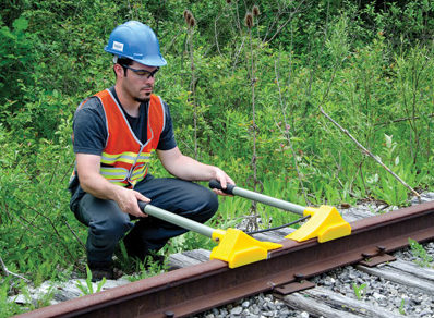 Urethane Wheel Chocks in use with worker